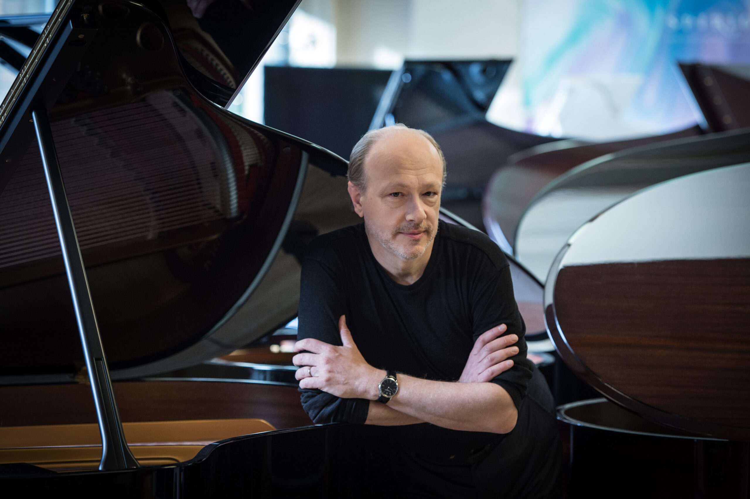 Marc-André Hamelin poses with many pianos.